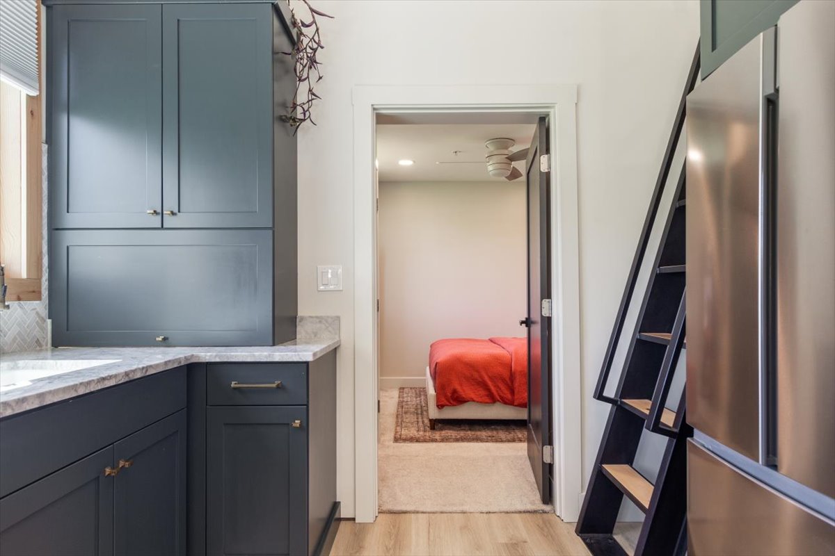 Hallway from the kitchen leading to the main bedroom